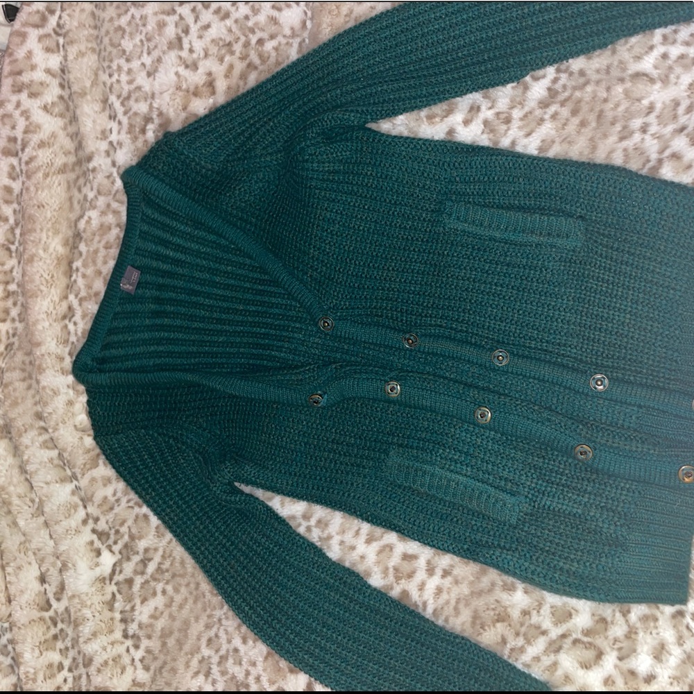 Green cardigan sweater.